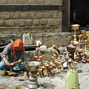 Cleaning butter lamps, Shey Palace