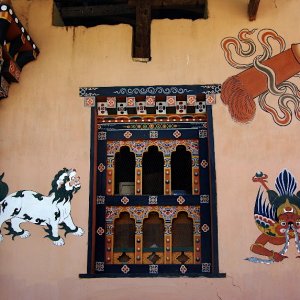Painted decoration on a traditional house in Lobesa village near Chimi Lhakhang, Bhutan