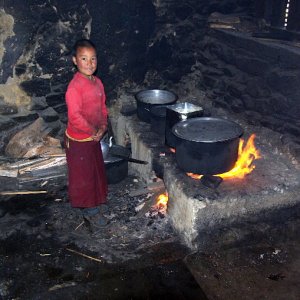 Young monk cooking lunch, Khewang Lhakhang, Phobjikha valley, Bhutan