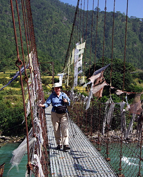 Iron chain suspension bridge across the river to Khamsum Yul le Chorten, Bhutan